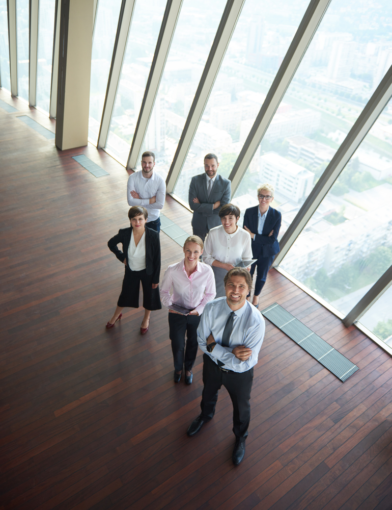 diverse business people group standing together as team in modern bright office interior diverse business people group standing together as team in modern bright office interior